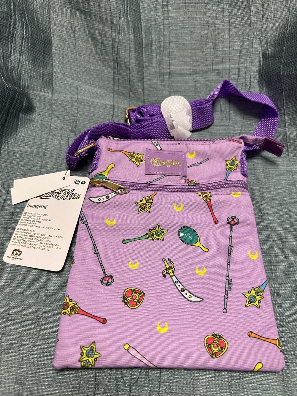 Loungefly Purple Sailor Moon Crossbody Bag with Magic Wand Print